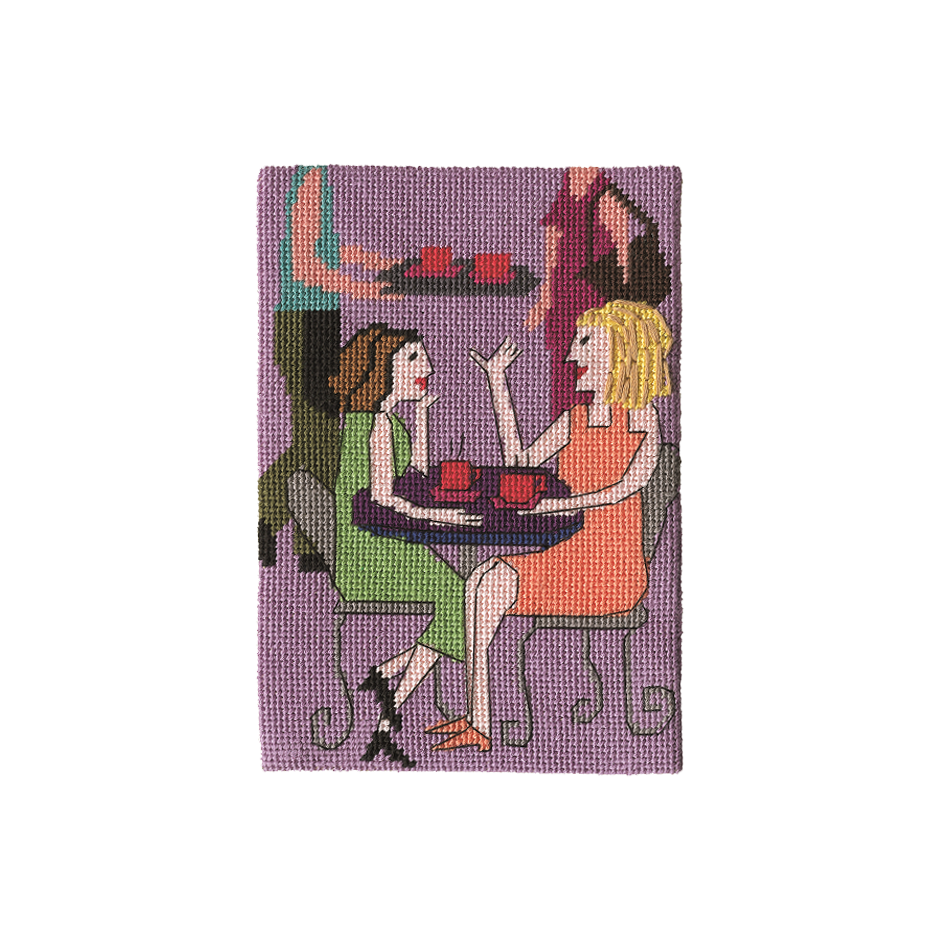 Needlepoint of two women sitting at a café table with a purple background