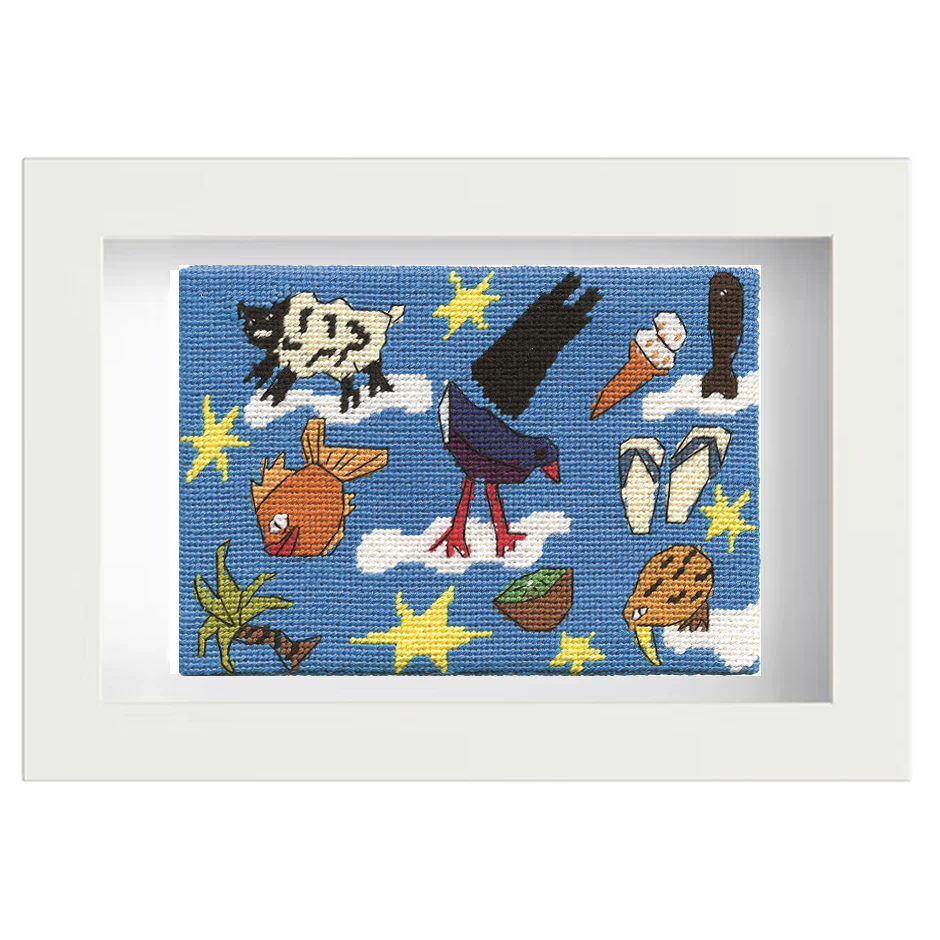 Framed needlepoint with colourful New Zealand icons on a blue background