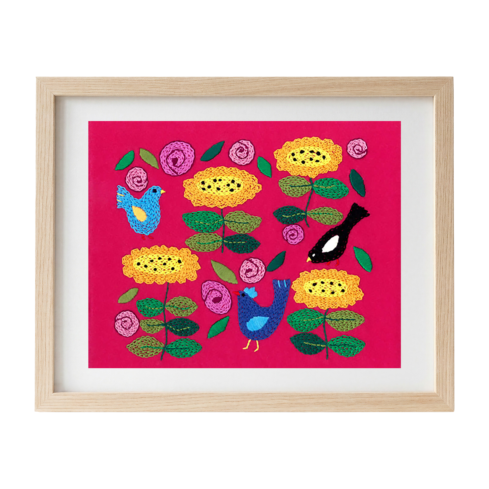 Framed embroidered artwork with colourful flowers and birds on a pink felt background