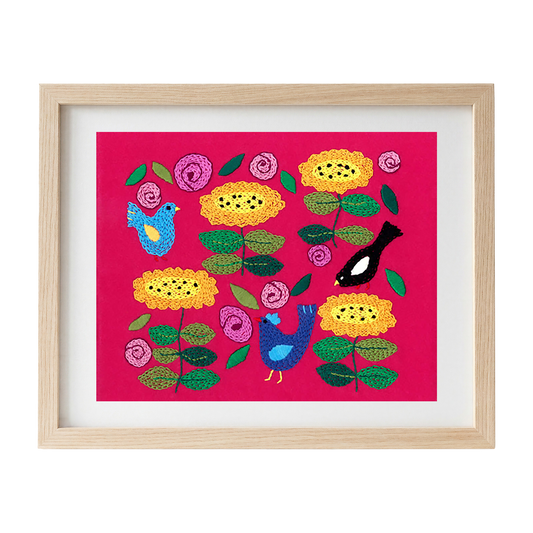 Framed embroidered artwork with colourful flowers and birds on a pink felt background