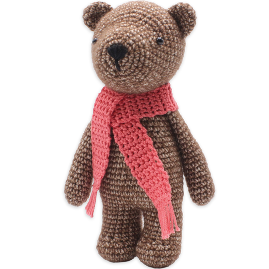 Crochet bear kit with a brown body, black eyes and nose, and a pink scarf, standing 20 cm tall