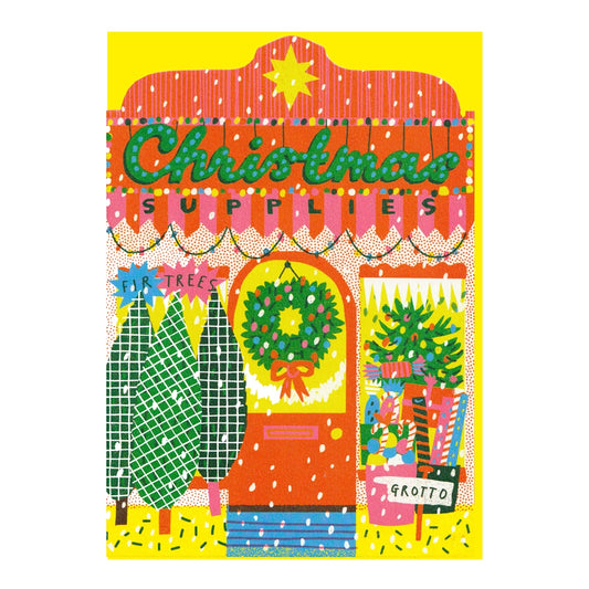 Illustrated note card featuring Christmas Supplies shop front decorated with artistic Christmas trees, wreath and wrapping paper in bright colours, on a white background