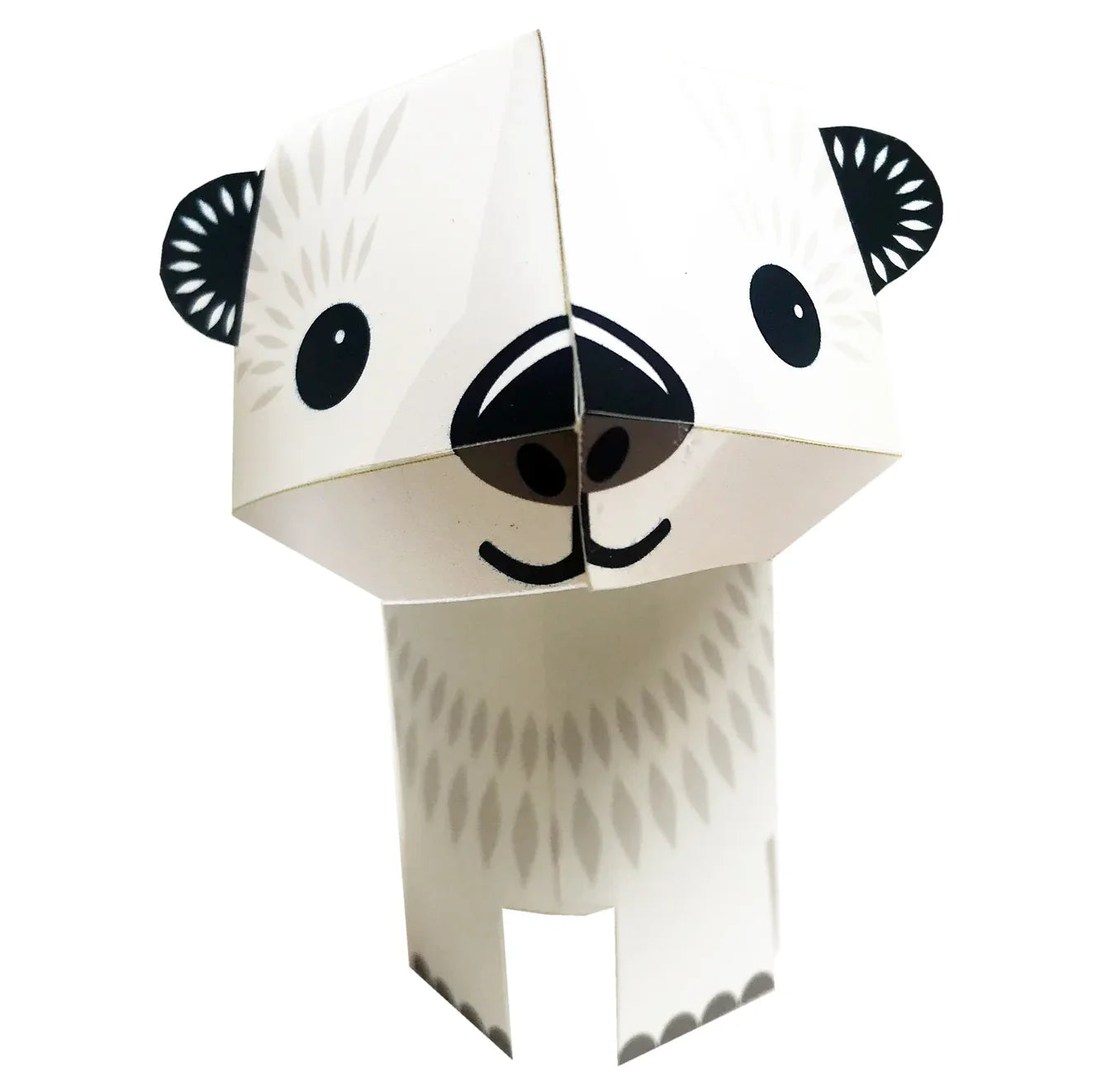 Paper decoration of a polar bear with black eyes and nose on a white background