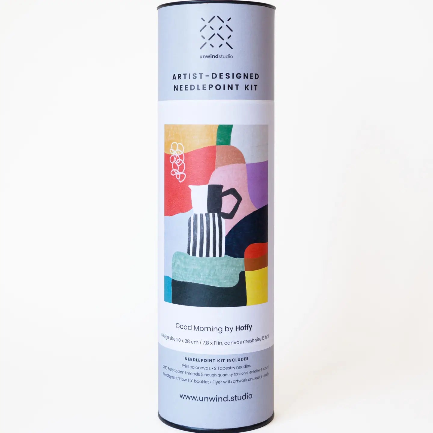 Tube packaging for a needlepoint kit with an abstract coffee-themed label