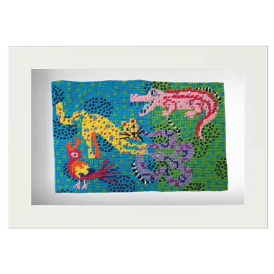 Colourful needlepoint postcard depicting a jungle scene with animals, framed in white
