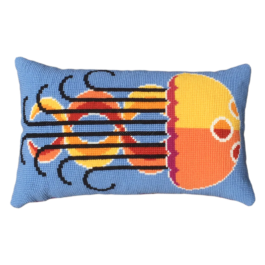 Cross stitch cushion featuring a colourful jellyfish design on a geometric background