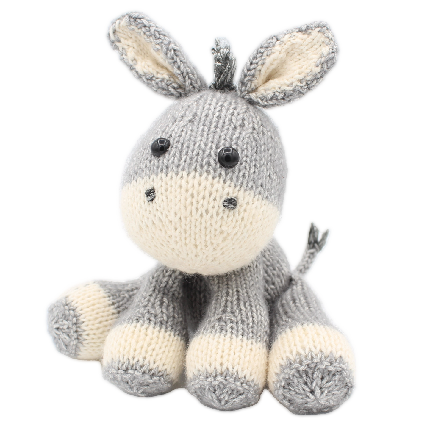 Knitted donkey toy in a grey and white colourway on a white background