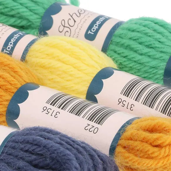 Close-up of colourful yarn skeins with labels on a white background