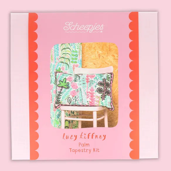 Lucy Tiffney, Scheepjes needlepoint kit packaging with a botanical cushion design on a pink background