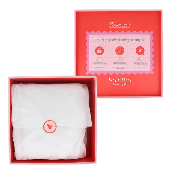 Red box with white tissue paper and heart logo, featuring Scheepjes brand on a white background