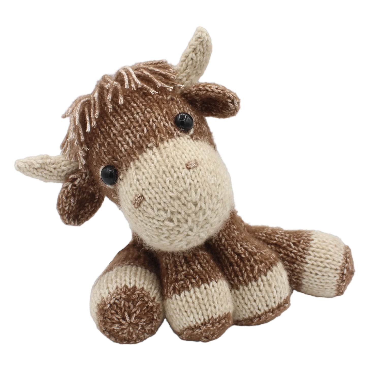Highland cow soft toy knitted in cotton-blend yarn on a white background