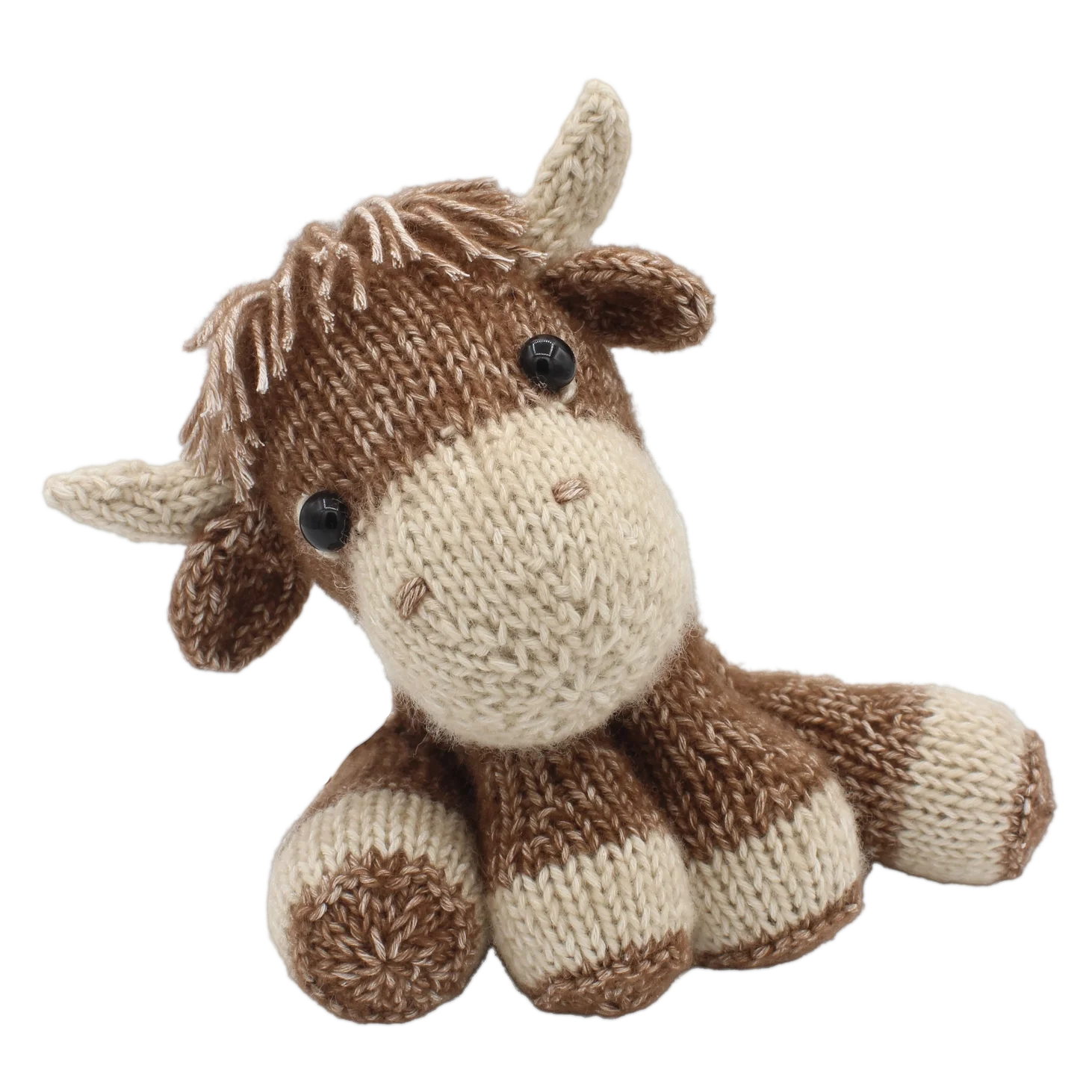 Highland cow soft toy knitted in cotton-blend yarn on a white background
