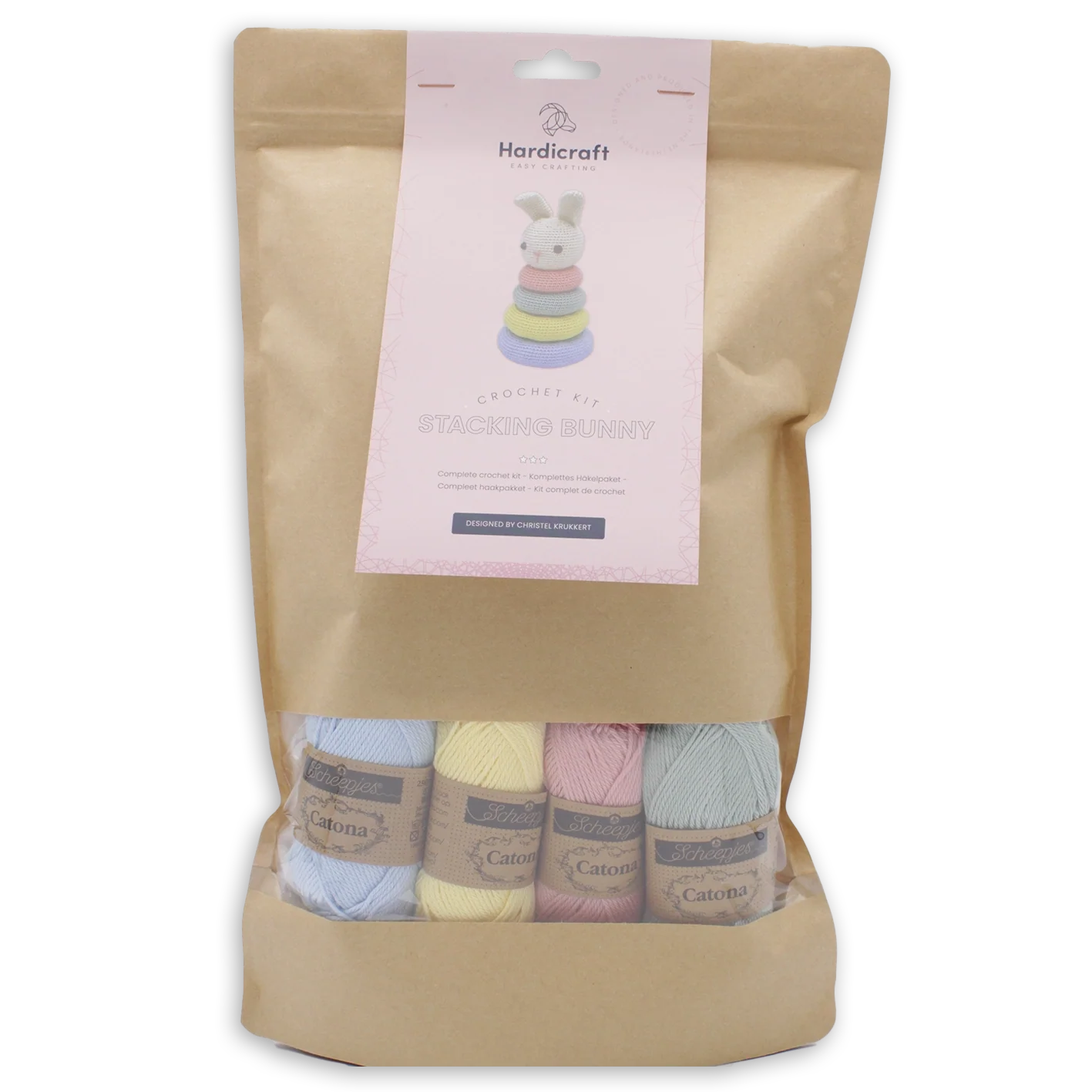 Kraft paper packaging with a label and window revealing pastel-coloured yarn on a white background