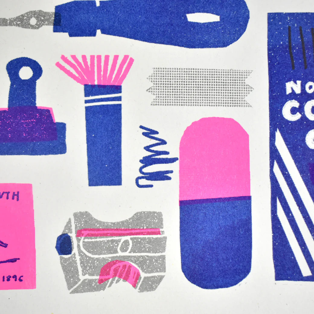 Close-up of a riso print featuring illustrated stationery items in pink, blue and silver