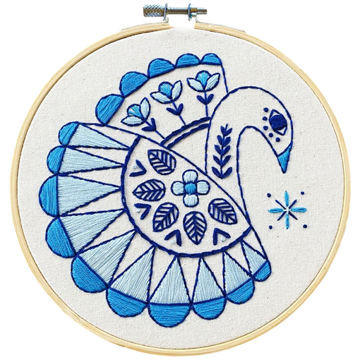 Embroidery hoop with blue and white swan design on a white background, the swan embroidery kit 