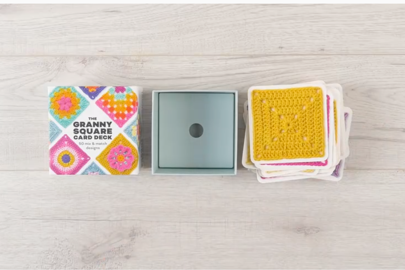 Granny Square card deck with colourful packaging on a light wooden surface